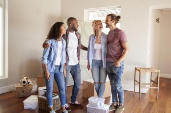 Friends Helping Couple To Move Into New Home