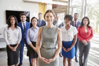 White businesswoman and her business team, group portrait