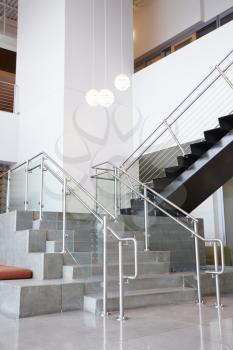 Atrium lobby and stairs in modern office building, vertical