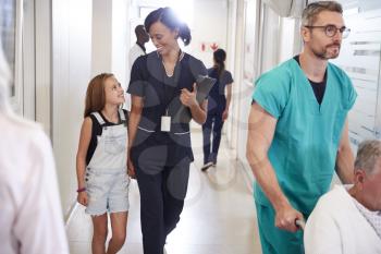 Busy Hospital Corridor With Medical Staff And Patients