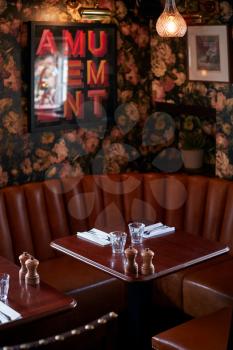 Interior Of Traditional English Pub With Table Set For Meal