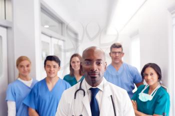 Portrait Of Multi-Cultural Medical Team Standing In Hospital Corridor