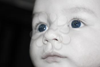 Close up of a baby boys face with emphasis on the eyes