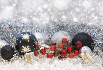 Christmas decorations on a silver starry background