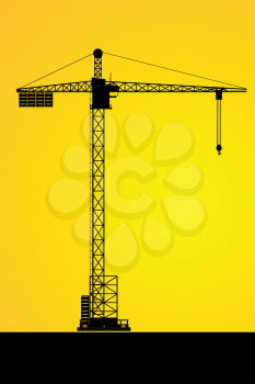 Silhouettes of a tower crane on building