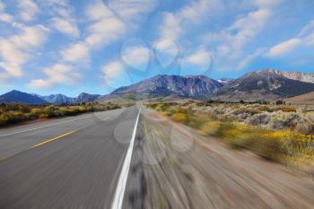 A trip at high speed through the colorful autumn desert to the distant mountains