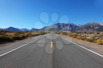 A trip at high speed through the colorful autumn desert to the distant mountains