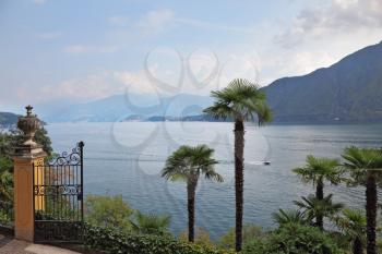 Lake Como in foggy a smoke. Magnificent park ashore - Villa Balbianella