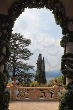 Magnificent park at the Italian villa-museum Balbyanello.Lake Como in the misty haze
