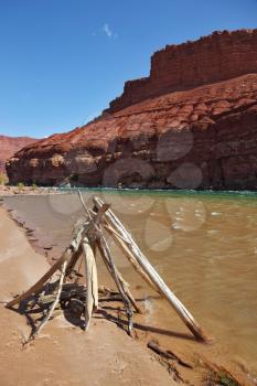 The banks of the Colorado River. The ritual construction of the Navajo dry poles and sticks