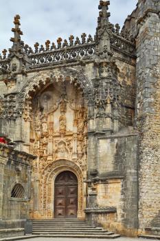 The magnificent medieval monastery Templars in Portugal. A fragment of the facade, decorated in traditional style