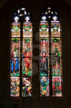  Bright multi-colour stained-glass windows in an ancient cathedral in Switzerland    