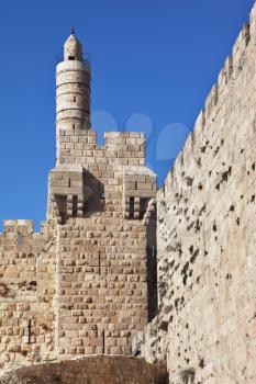 The walls of the eternal Jerusalem. Tower of David on a sunny day. Jerusalem illuminated soft rays sunset