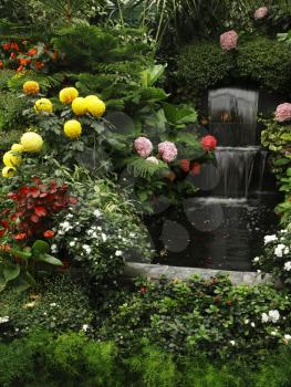 Magnificent cascade fountain in well-known Butchard -garden on island Vancouver