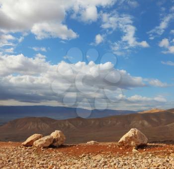 Magnificent transparent day in Judean desert. Huge boulders along highway, an unflawed sky