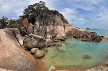 Picturesque coastal cliffs and azure sea. Koh Samui