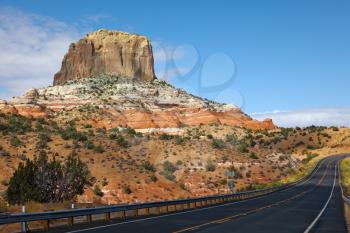 Magnificent American highway in stone desert. State of Utah, early morning