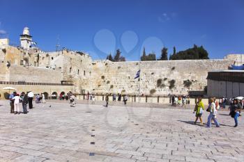 The western wall of the Jerusalem temple and the area before it, shined by the sun