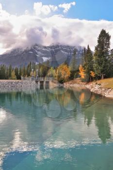 Early autumn in the Rocky Mountains of Canada.  Brilliant turquoise Bow Lake and the picturesque mountain