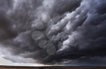 The autumn storm approaches on fields after harvesting. Montana, the USA