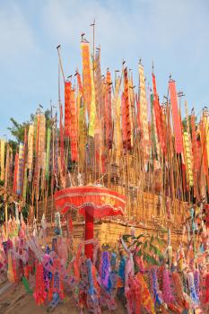 Thai New Year - Songkran. Colorful multicolored flags and pennants adorn a special bamboo tower