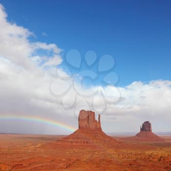 Rainbow in a red desert. Monument Valley in the autumn, after rain