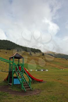 Park attractions for children at the prestigious mountain resort in the Alps. Beginning of autumn
