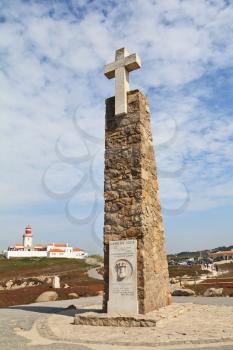The modern lighthouse and obelisk with a large white cross. Cabo da Roca - the extreme western point of Europe