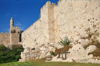 The ancient walls of the eternal Jerusalem and the Tower of David. Beautiful sunset