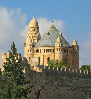 The Catholic Church of Dormition in Jerusalem. The morning sun illuminates the dome and the tower of the abbey