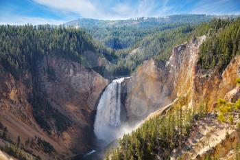 Autumn to Yellowstone national park. The well-known mountain falls, the river and forest