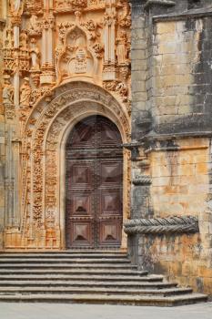 A fragment of the facade, decorated in traditional style. The magnificent medieval monastery Templars in Portugal.