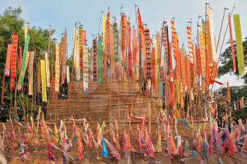 The flags and pennants adorn a special bamboo tower.  Thai New Year - Songkran