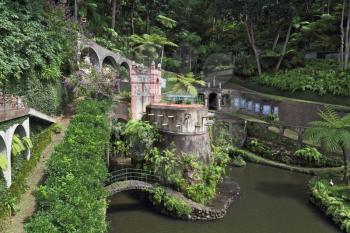 Exotic Park in Madeira. The lake and the scenic bridge