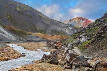  National park Landmannalaugar in Iceland. The green stone rock and stream in the gorge