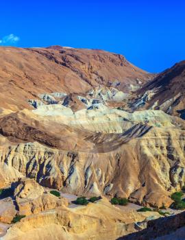 Picturesque multi-colored taluses dry sandstone. Ancient mountains in the valley of the Dead Sea