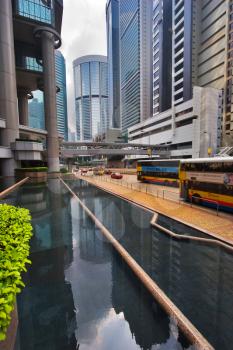  Narrow street with pool and skyscrapers in Hong Kong    