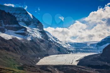 The surface of glacier is covered with huge cracks. Melting Columbia Icefield in Banff National Park, Canada