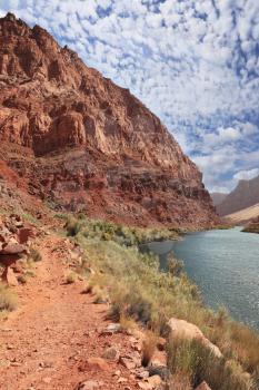 Pure emerald Colorado River among the steep mountains of red sandstone.