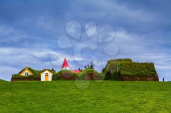 The village ancestors. The reconstituted village - a museum of the first settlers in Iceland. Roofs of houses covered with turf and grass