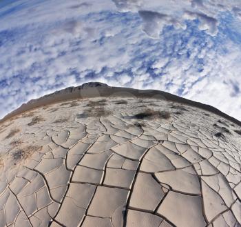 Cracked clay crust is vast desert - takyr. California, USA. Photo taken fisheye lens