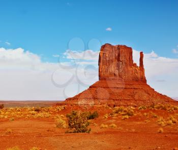  Famous rock - mitts of red sandstone. Magical landscape Monument Valley in Arizona.