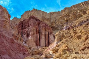  Warm January day in Israel. Gorge in the dry mountains of Eilat and natural Amram pillars of pink sandstone