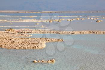 The shoaled Dead Sea at coast of Israel.  Fused salt out of the water