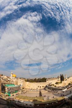 Autumn holiday of Sukkot. Windy autumn day in Jerusalem. The area of the Western Wall of the Temple after the prayer