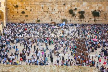 Autumn holiday of Sukkot in Jerusalem. Western Wall of the Temple. The huge crowd of Jews for a prayer has gathered on the square