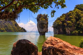  Calm and warm Andaman Sea and the quaint island. James Bond Island. The tourist season in Thailand