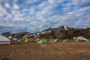 Tourist camp is located in valley of the park. Rhyolite mountains surround the flat valley of National Park Landmannalaugar