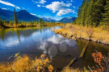 Magic lakes Vermillon in the Rocky Mountains of Canada. Solar patches of light in water of the lake.  Concept of active tourism and ecotourism 