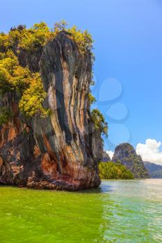 The delightful island rock in the gulf. The Andaman Sea at the coast of Thailand